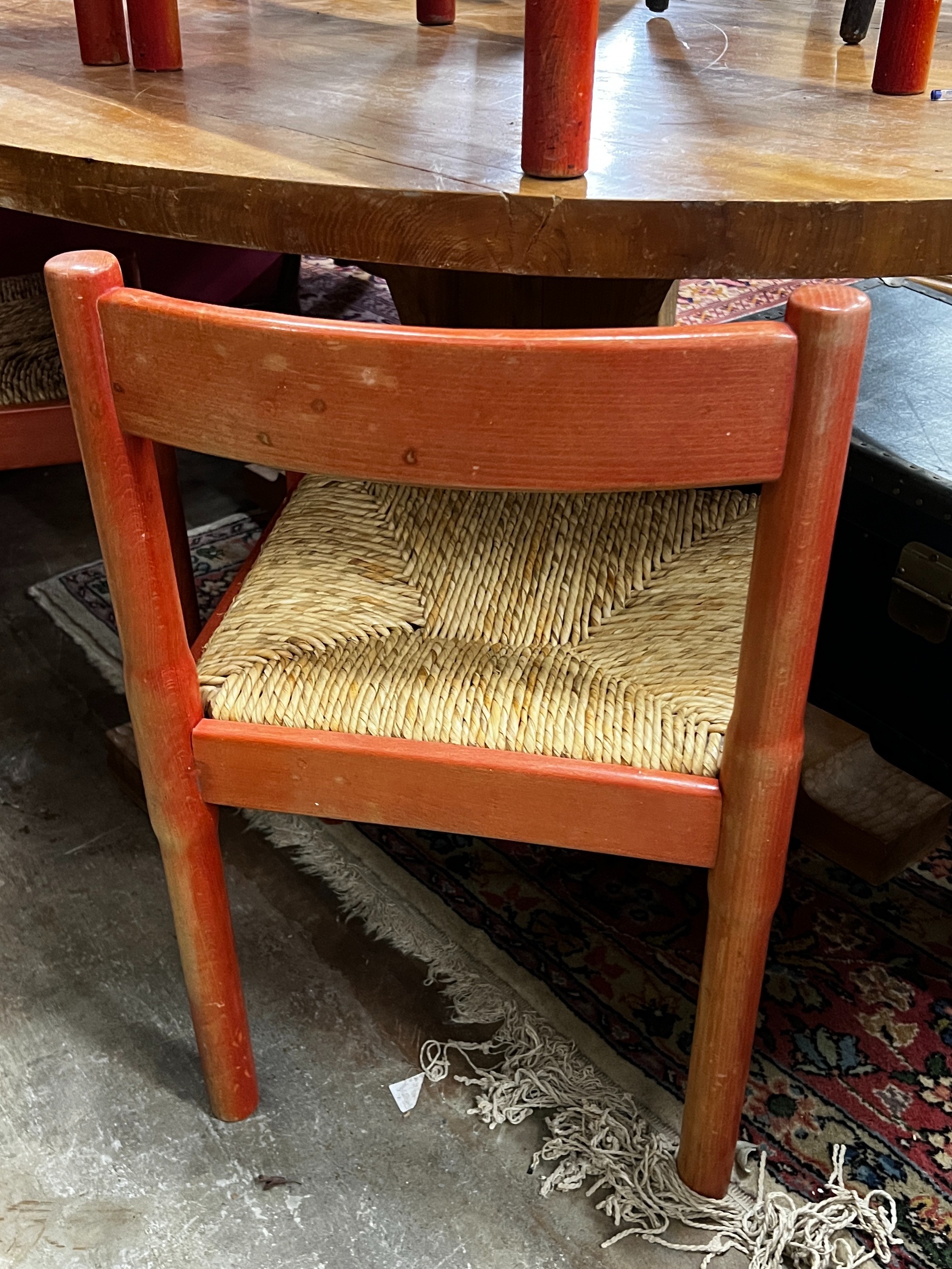 A set of four Magistretti Carimate chairs with rush seats